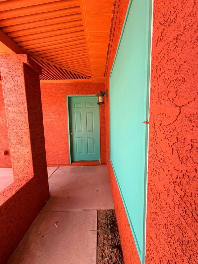 Terracotta and teal patio walkway repaint